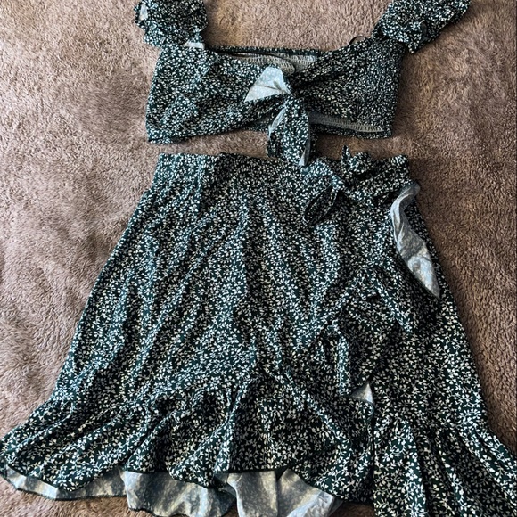 M/L. Two piece wrap up tie skirt and blouse WORN ONCE